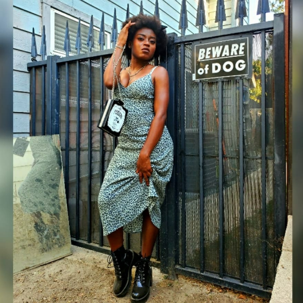 Claim the Kingdom Midi Dress from DollsKill!